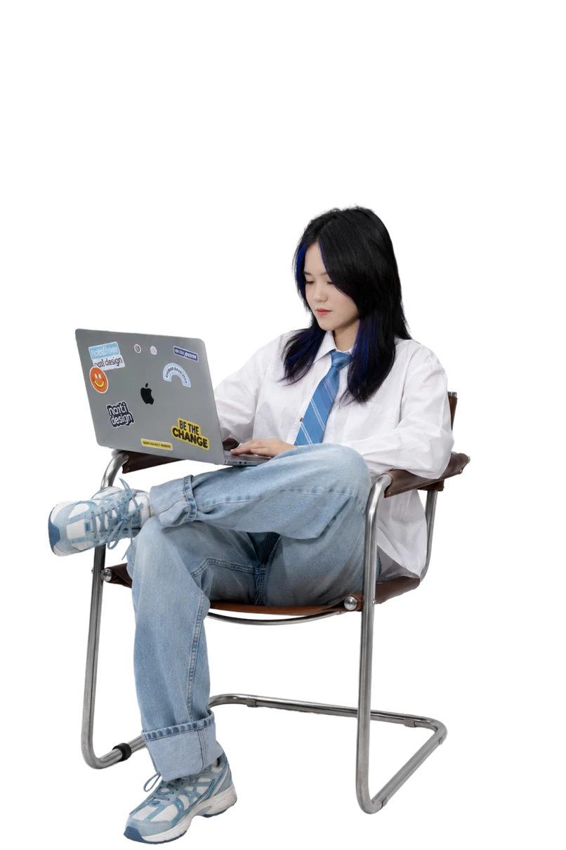 Emma working on a laptop